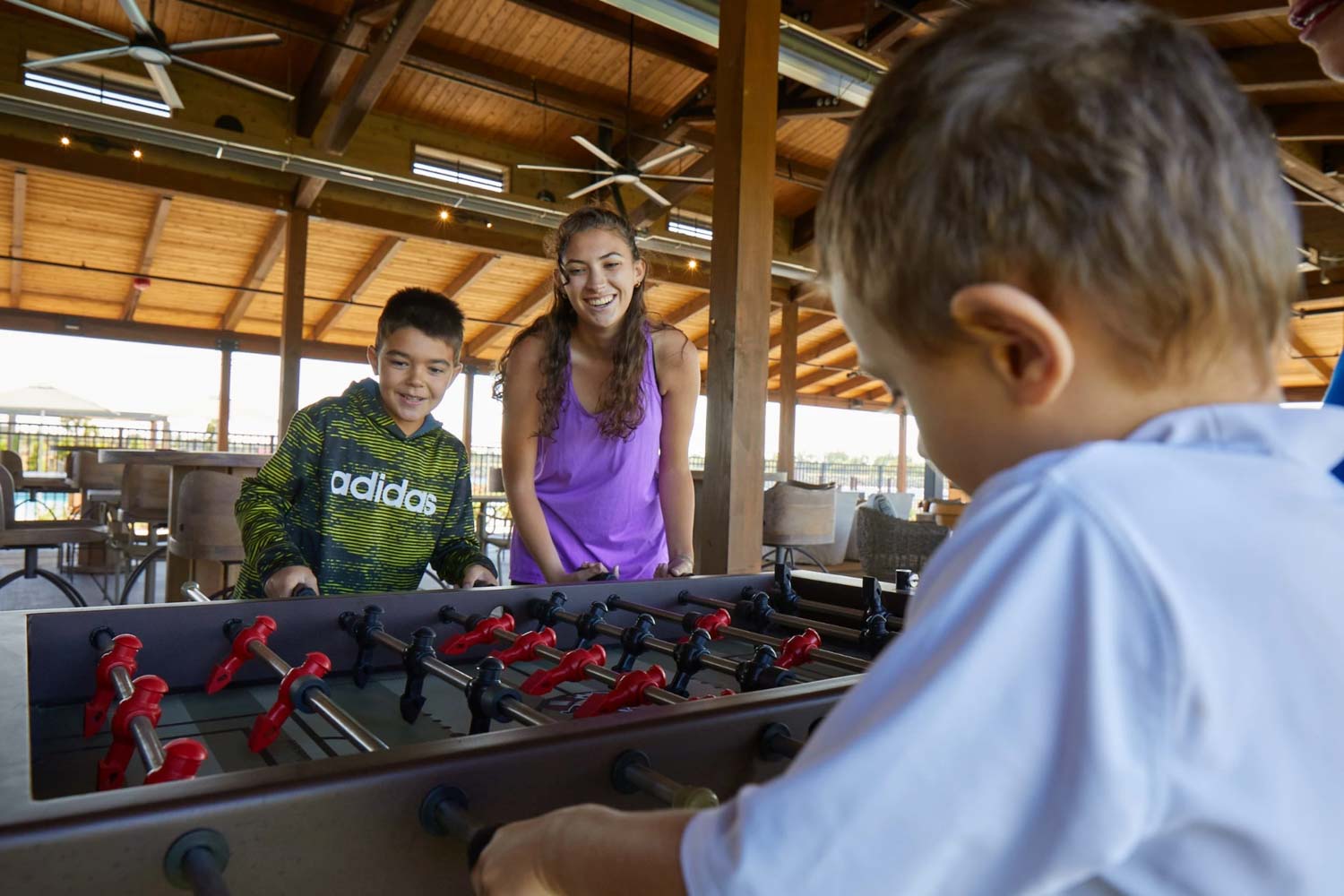 kids playing foosball in pavillion