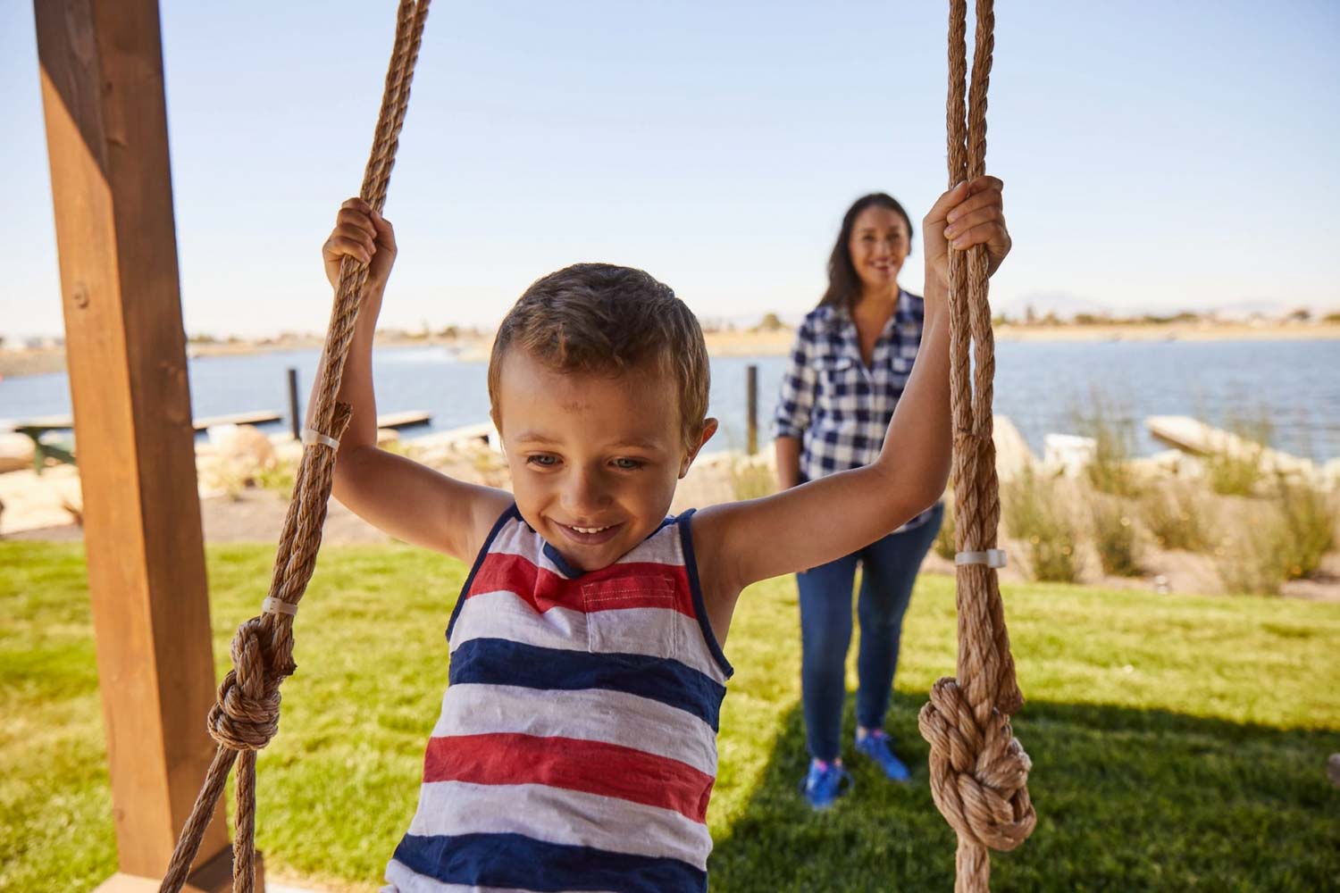 child on swing in pavillion